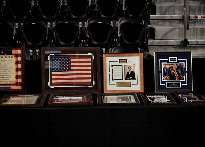 Framed memorabilia arranged on the silent auction table