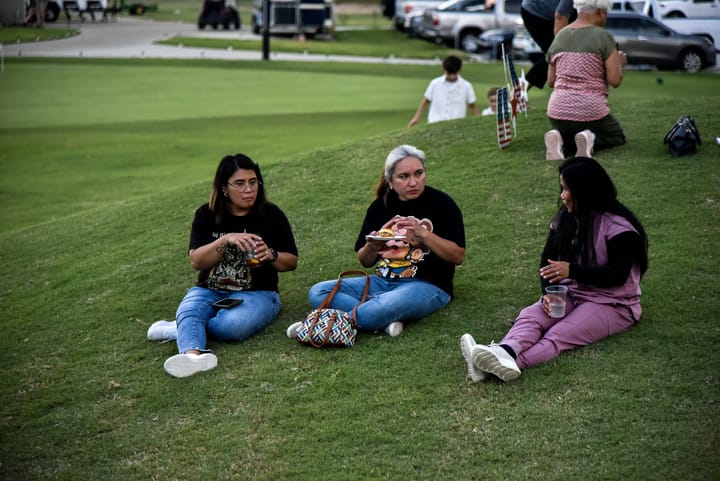 Three guests relaxing on the lawn