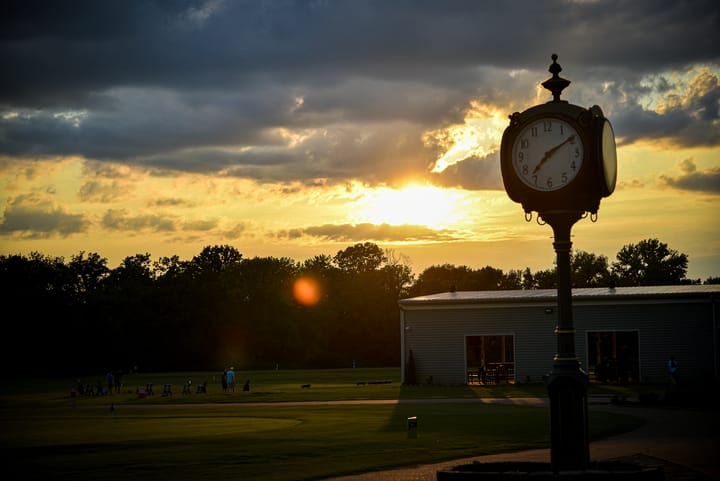 Sunset behind the outdoor clock